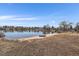 Scenic lakefront property with a small boat ready for water adventures, perfect for serene waterfront living at 4760 W Evans Ave, Denver, CO 80219