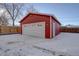 New detached garage with white door and red exterior at 4145 Otis St, Wheat Ridge, CO 80033