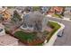 Back aerial view of home with a well-maintained lawn, deck, privacy fence, and mature trees at 5486 S Cathay Way, Centennial, CO 80015