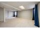 Spacious finished basement with carpet, blue curtains, a closet and recessed lighting at 5486 S Cathay Way, Centennial, CO 80015