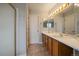 Bathroom with double sink vanity, tile flooring, and shower with glass doors at 5486 S Cathay Way, Centennial, CO 80015