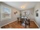 Cozy dining room with hardwood floors and natural light from the window at 5486 S Cathay Way, Centennial, CO 80015