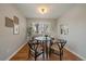 Cozy dining room with hardwood floors and natural light from the window at 5486 S Cathay Way, Centennial, CO 80015