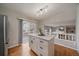Kitchen island featuring white cabinetry and stone countertops with a sliding glass door leading to the deck at 5486 S Cathay Way, Centennial, CO 80015