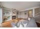 Cozy living room boasts a fireplace with built-in shelves and a gray sectional couch with soft throw pillows at 5486 S Cathay Way, Centennial, CO 80015