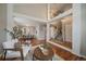Open-concept living space with hardwood floors and a staircase leading to the upper level at 5486 S Cathay Way, Centennial, CO 80015