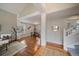 Inviting living area with hardwood floors connecting to the dining space and staircase at 5486 S Cathay Way, Centennial, CO 80015