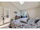 Bedroom features a skylight, desk area, and neutral color scheme at 3596 S Depew St # 2, Lakewood, CO 80235