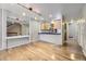 Bright dining area adjacent to the kitchen, featuring hardwood floors and stylish pendant lights at 3596 S Depew St # 2, Lakewood, CO 80235