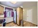 Functional kitchen with stainless steel refrigerator, ample cabinet space, and hardwood floors at 3596 S Depew St # 2, Lakewood, CO 80235