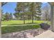 A well-manicured lawn with a path leading to the property and a partially covered grill area at 3596 S Depew St # 2, Lakewood, CO 80235