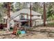 Backyard with patio, gazebo, and play equipment, showcasing a Gathering-friendly outdoor space at 8795 Rudd Rd, Evergreen, CO 80439