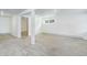 Spacious basement with neutral carpet, bright walls, and natural light at 8795 Rudd Rd, Evergreen, CO 80439
