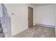 Neutral bedroom featuring plush carpet and a door to provide privacy at 8795 Rudd Rd, Evergreen, CO 80439