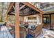 Relaxing outdoor gazebo with comfortable seating and scenic wooded views at 8795 Rudd Rd, Evergreen, CO 80439