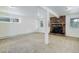 Bright basement with brick fireplace and ample space for customization at 8795 Rudd Rd, Evergreen, CO 80439
