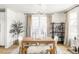 Elegant dining room featuring a wooden table, neutral tones, and natural light at 2469 S Acoma St, Denver, CO 80223