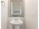 Powder room features modern sink and decorative mirror at 3692 Celestial Ave, Castle Rock, CO 80109