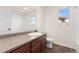 Bathroom featuring a vanity with a sink, a toilet, a tub/shower combo, and a window for natural light at 3692 Celestial Ave, Castle Rock, CO 80109