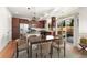 Open-concept kitchen features wood floors, stainless appliances and access to the backyard patio at 3692 Celestial Ave, Castle Rock, CO 80109