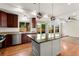 Open-concept kitchen features stainless appliances, granite countertops, and hardwood floors at 3692 Celestial Ave, Castle Rock, CO 80109