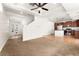 Open-concept design showing a kitchen and living room with a staircase at 3692 Celestial Ave, Castle Rock, CO 80109
