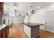 Open living space with hardwood floors, island, and plenty of natural light at 3692 Celestial Ave, Castle Rock, CO 80109