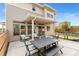 Outdoor patio features a table and chairs perfect for enjoying the outdoors with a view of the backyard at 3692 Celestial Ave, Castle Rock, CO 80109