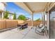 Inviting covered patio with an outdoor dining table and comfortable lounge chairs at 3692 Celestial Ave, Castle Rock, CO 80109
