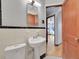 Classic bathroom with pedestal sink, black and white tile detail, and ample lighting at 1605 Saint Paul St # 6, Denver, CO 80206