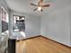 Cozy bedroom featuring hardwood floors, a window, and a modern ceiling fan at 1605 Saint Paul St # 6, Denver, CO 80206