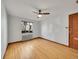 Comfortable bedroom with hardwood floors, radiator heating, and a ceiling fan at 1605 Saint Paul St # 6, Denver, CO 80206