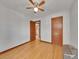 Bright bedroom featuring hardwood floors, ceiling fan, and trim throughout at 1605 Saint Paul St # 6, Denver, CO 80206