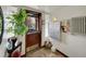 Bright entryway featuring a secured entry door, fresh plants and package delivery system at 1605 Saint Paul St # 6, Denver, CO 80206