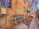 Apartment building exterior with brick and multiple utility meters and sidewalk at 1605 Saint Paul St # 6, Denver, CO 80206