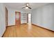Spacious living room with hardwood floors, ample natural light, and unique floating shelves at 1605 Saint Paul St # 6, Denver, CO 80206