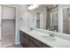 Modern bathroom featuring a double vanity and shower at 3342 N Buchanan Way, Aurora, CO 80019