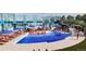 Resort-style community pool with lounge chairs and water slide, perfect for relaxation and recreation at 3342 N Buchanan Way, Aurora, CO 80019