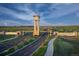 Grand entrance to The Aurora Highlands community with lush landscaping and scenic views at 3342 N Buchanan Way, Aurora, CO 80019