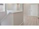 Entryway showing the staircase leading to upper level and a front door at 3342 N Buchanan Way, Aurora, CO 80019