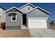 Charming home with a combination of brick and siding, complemented by a two-car garage and well-lit exterior at 3342 N Buchanan Way, Aurora, CO 80019