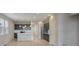 Open-concept kitchen with stainless steel appliances and an island with seating at 3342 N Buchanan Way, Aurora, CO 80019