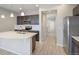 Contemporary kitchen with a large island, stainless steel appliances, and lots of counterspace at 3342 N Buchanan Way, Aurora, CO 80019