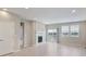 Bright and airy living room featuring a fireplace and sliding door to an outdoor space at 3342 N Buchanan Way, Aurora, CO 80019