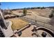 Backyard view with brick patio, firepit, and manicured lawn overlooking community walking path and green space at 6019 S Little River Way, Aurora, CO 80016