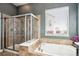 Well-appointed bathroom with a walk-in shower, soaking tub, and stylish tile work for a spa-like experience at 6019 S Little River Way, Aurora, CO 80016