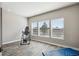 Bonus room displaying wood-style flooring, ample natural light, and an inversion table with exercise mat at 6019 S Little River Way, Aurora, CO 80016