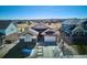 Exterior view of a well-maintained home with a manicured front yard, driveway, and attached garage at 6019 S Little River Way, Aurora, CO 80016