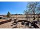 The outdoor patio offers comfortable seating near a cozy brick fire pit with views of the neighborhood at 6019 S Little River Way, Aurora, CO 80016