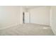 Small bedroom with carpet and door to another room at 17326 E 91 Way, Commerce City, CO 80022